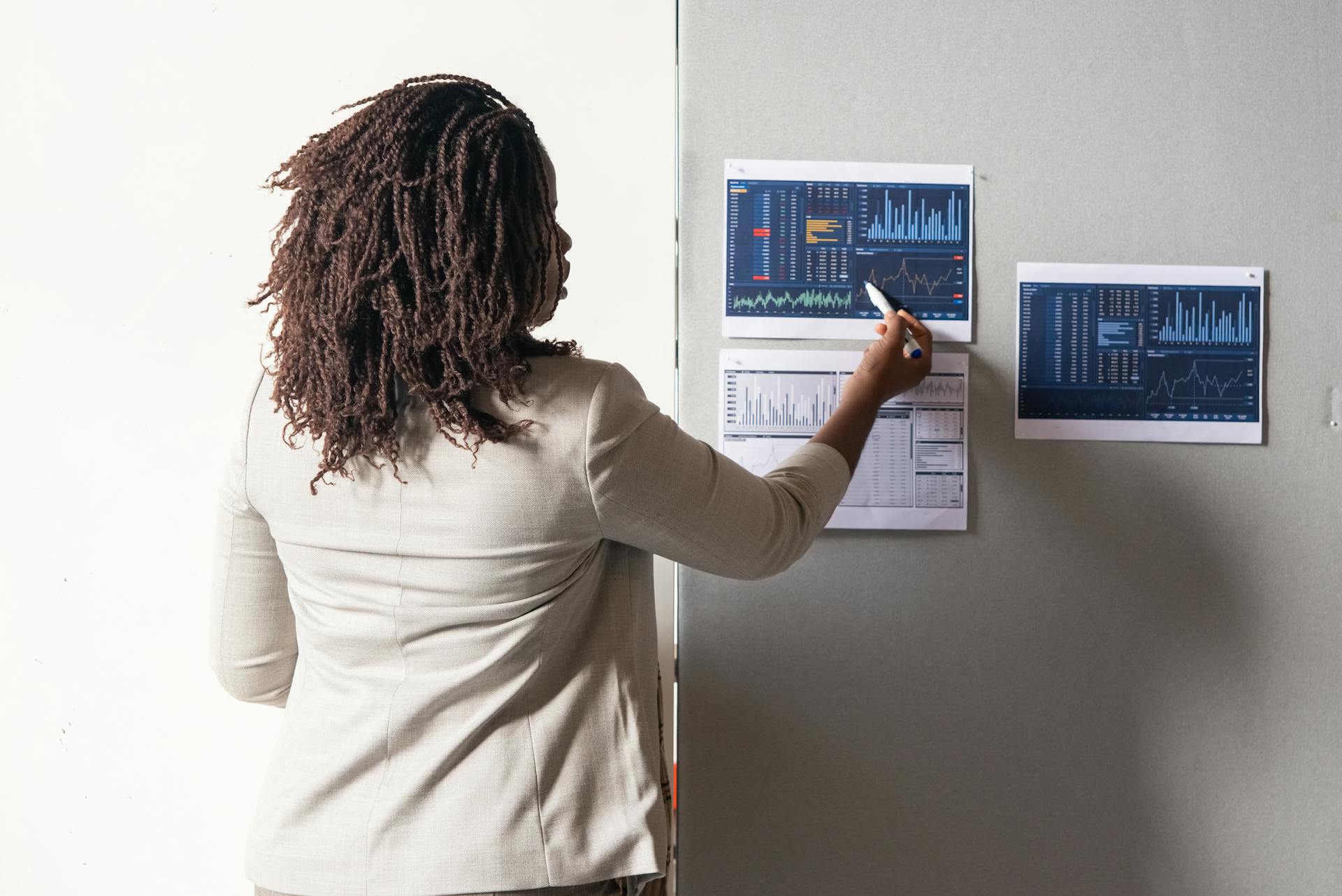 woman pointing at chart